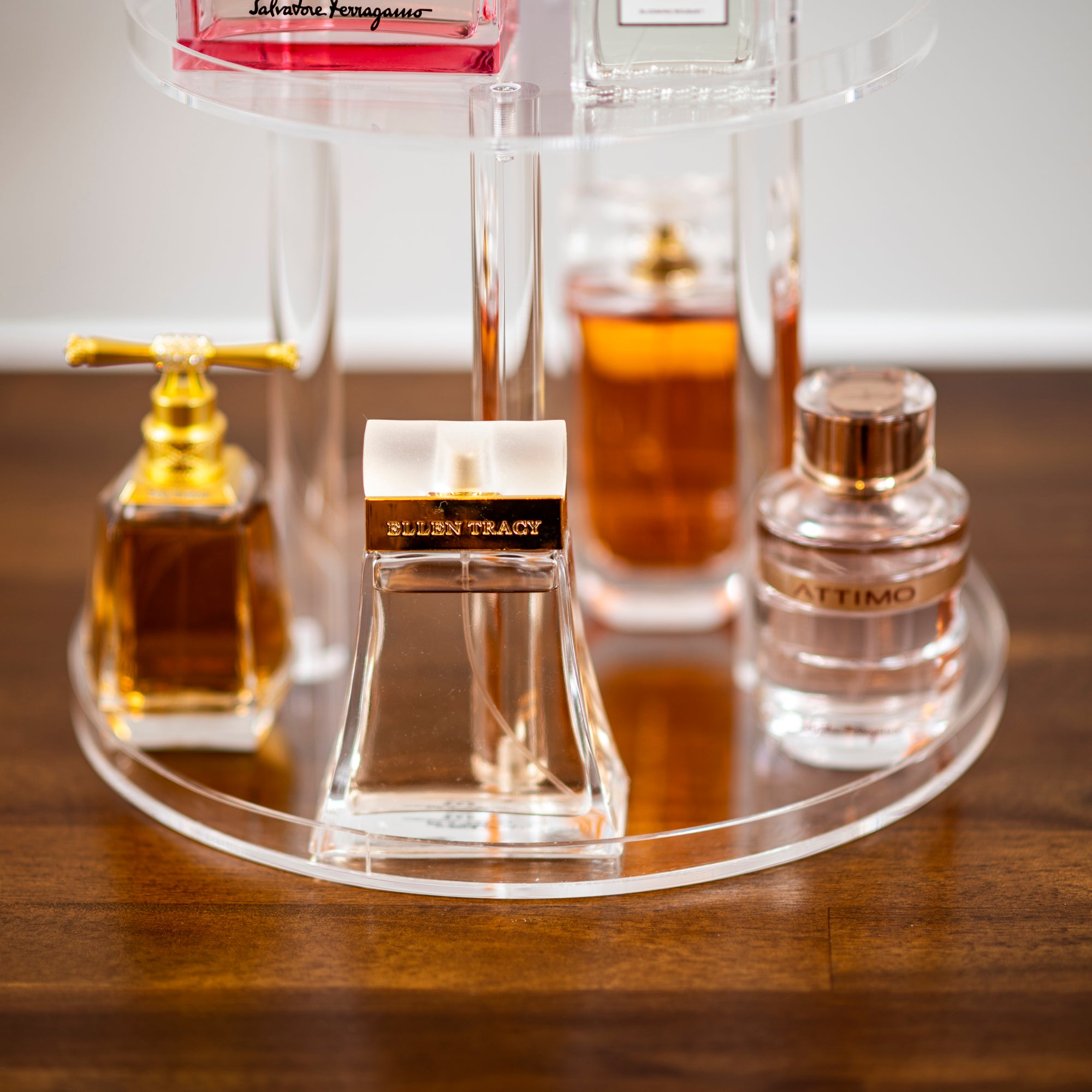 elegant round acrylic perfume stand
