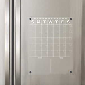 white acrylic calendar on refrigerator